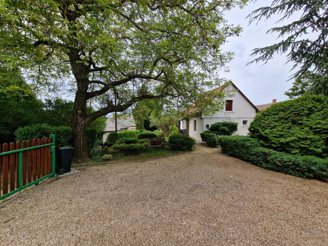 Charming single-family home with nature-oriented property design and majestic old tree population.