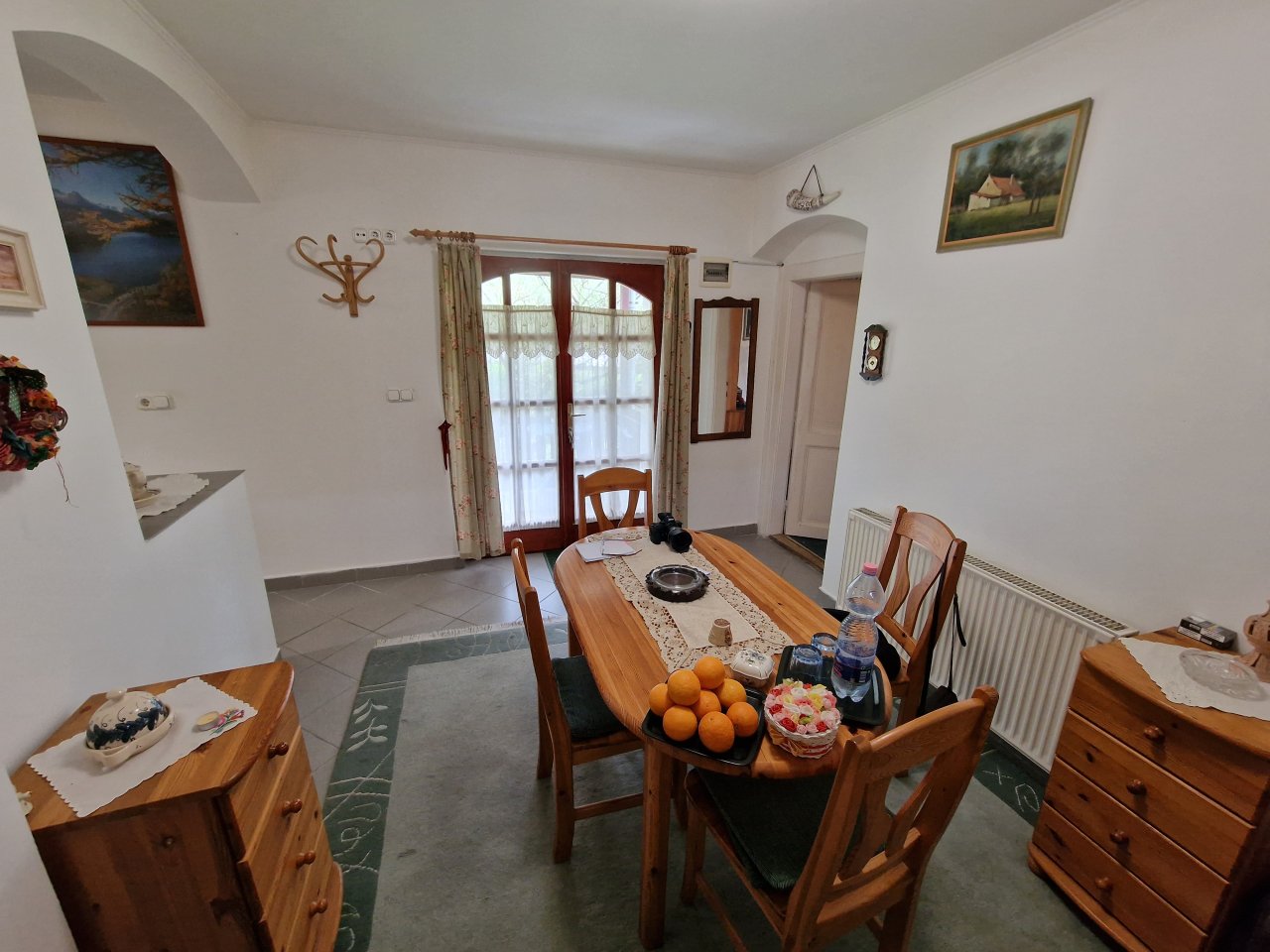 Light-flooded dining area with charming winter garden access and elegant room division