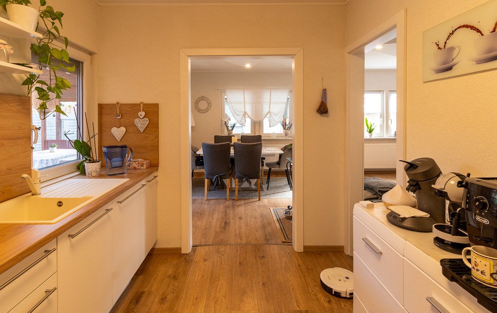 Open kitchen with flowing layout and direct connection to the living area