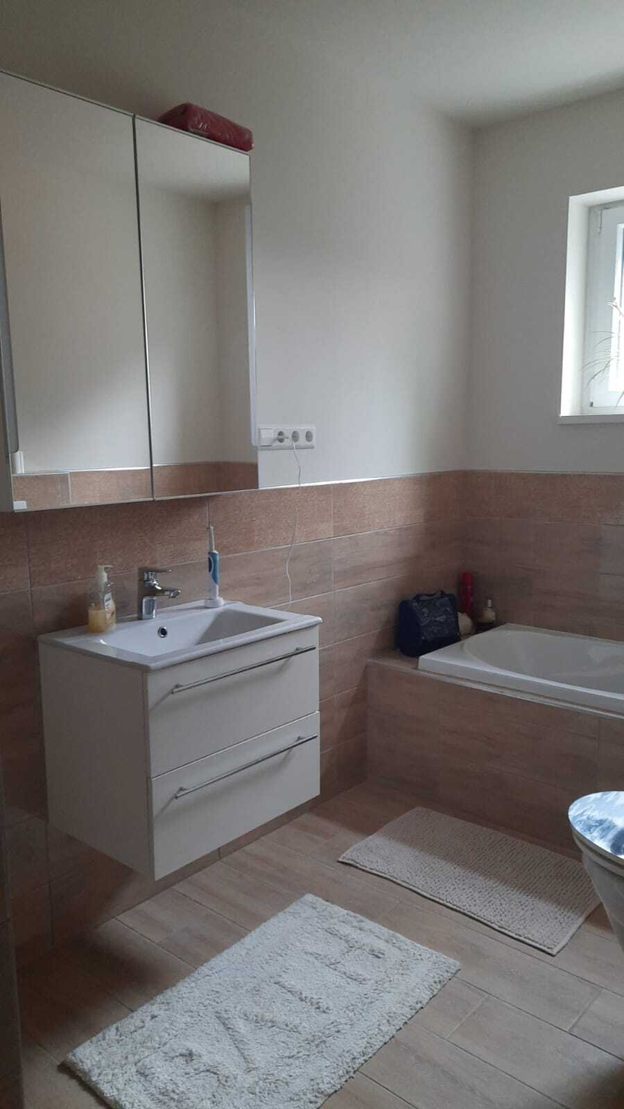 Modern bathroom with double sink and spacious bathtub