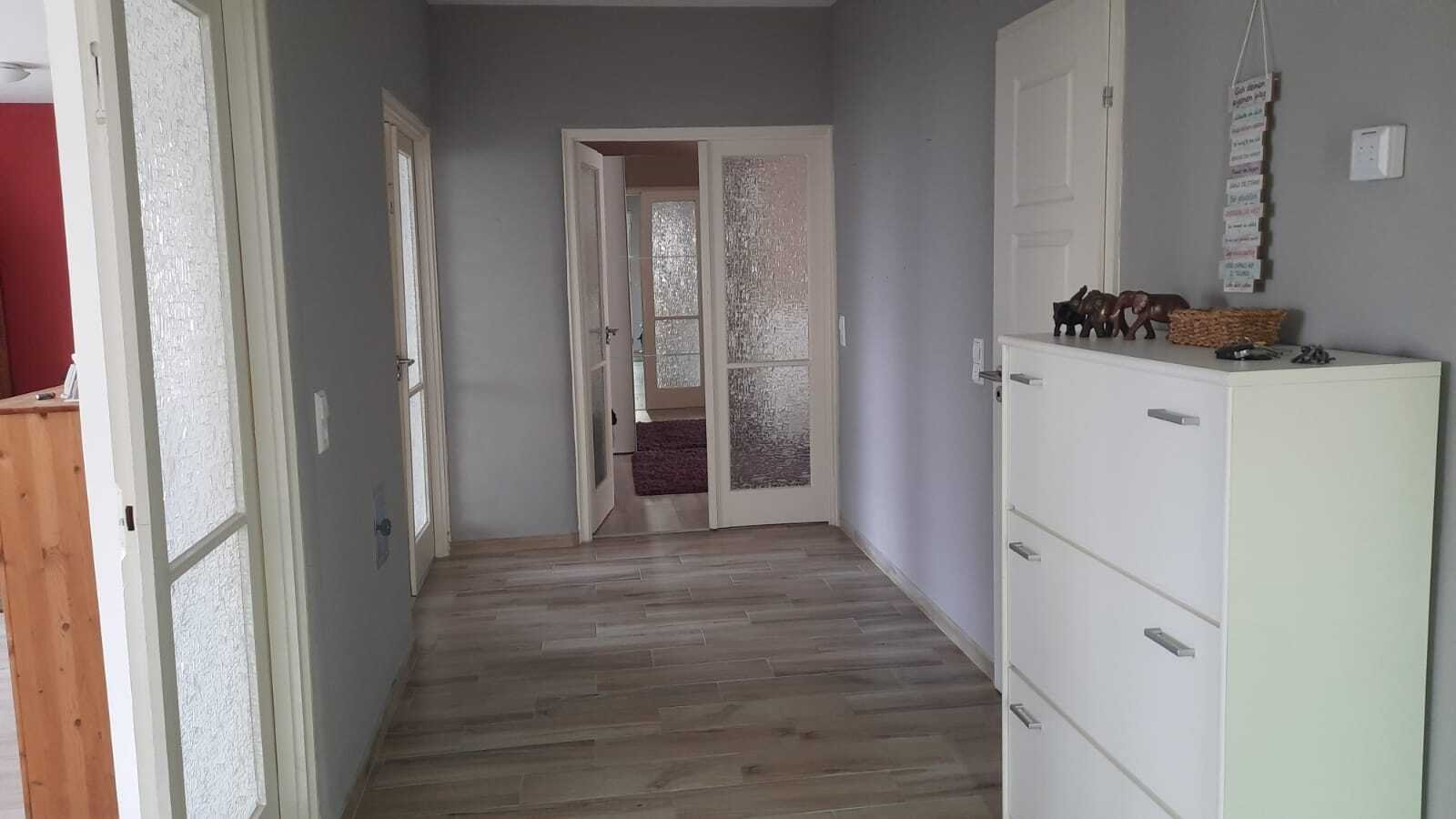 Central corridor with practical space access and multiple entrances